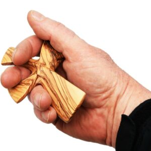 Olive wood curved 'Comfort Cross' in the palm of a hand