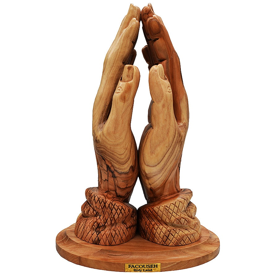 Statue Of The Praying Hand Out Of Olive Wood