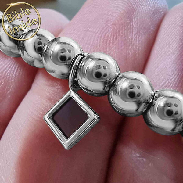 Bracelet with Nano 'Bible Inside' Stainless Steel Balls - held in a hand